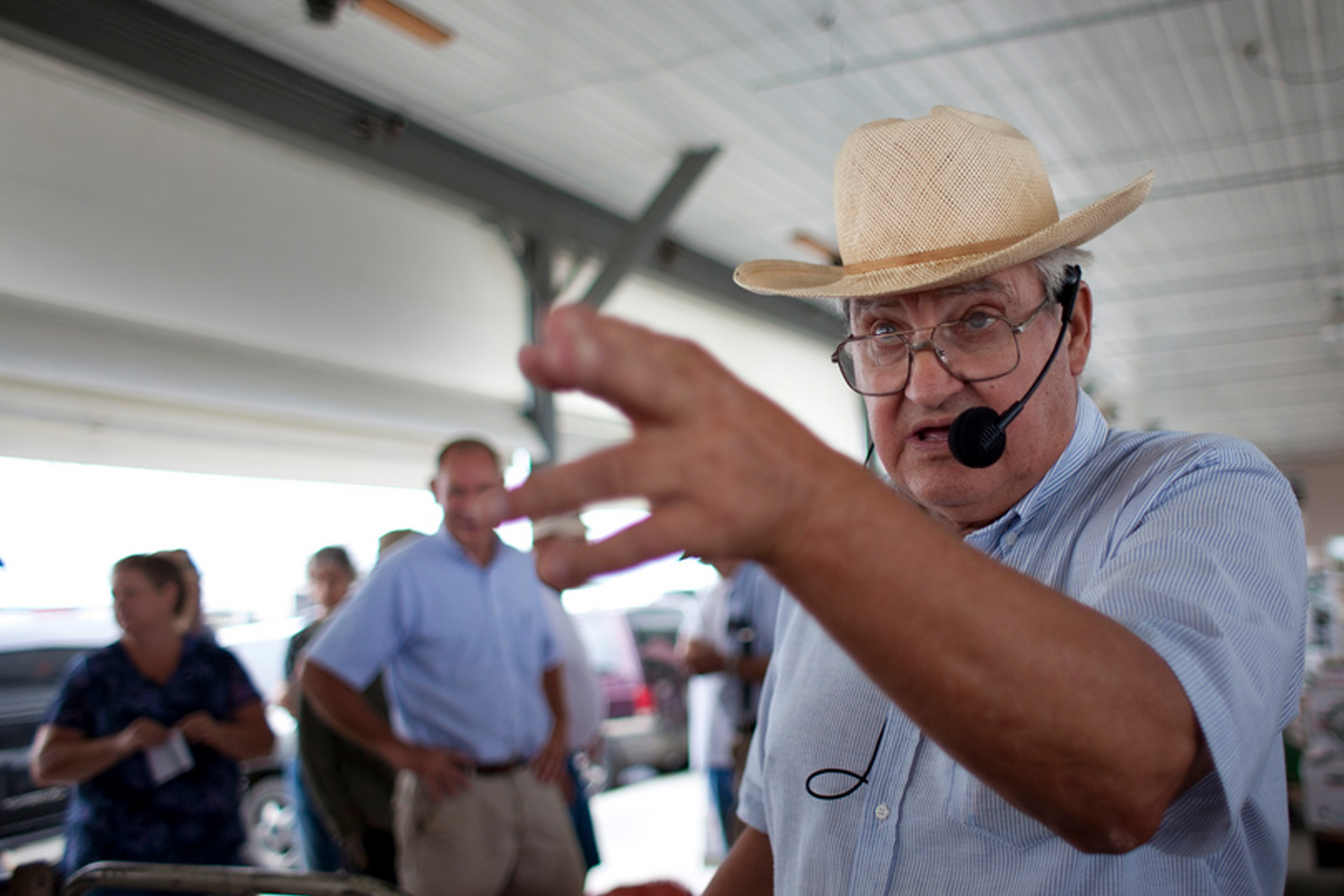 Man in cowbot hat pointing and auctioneering